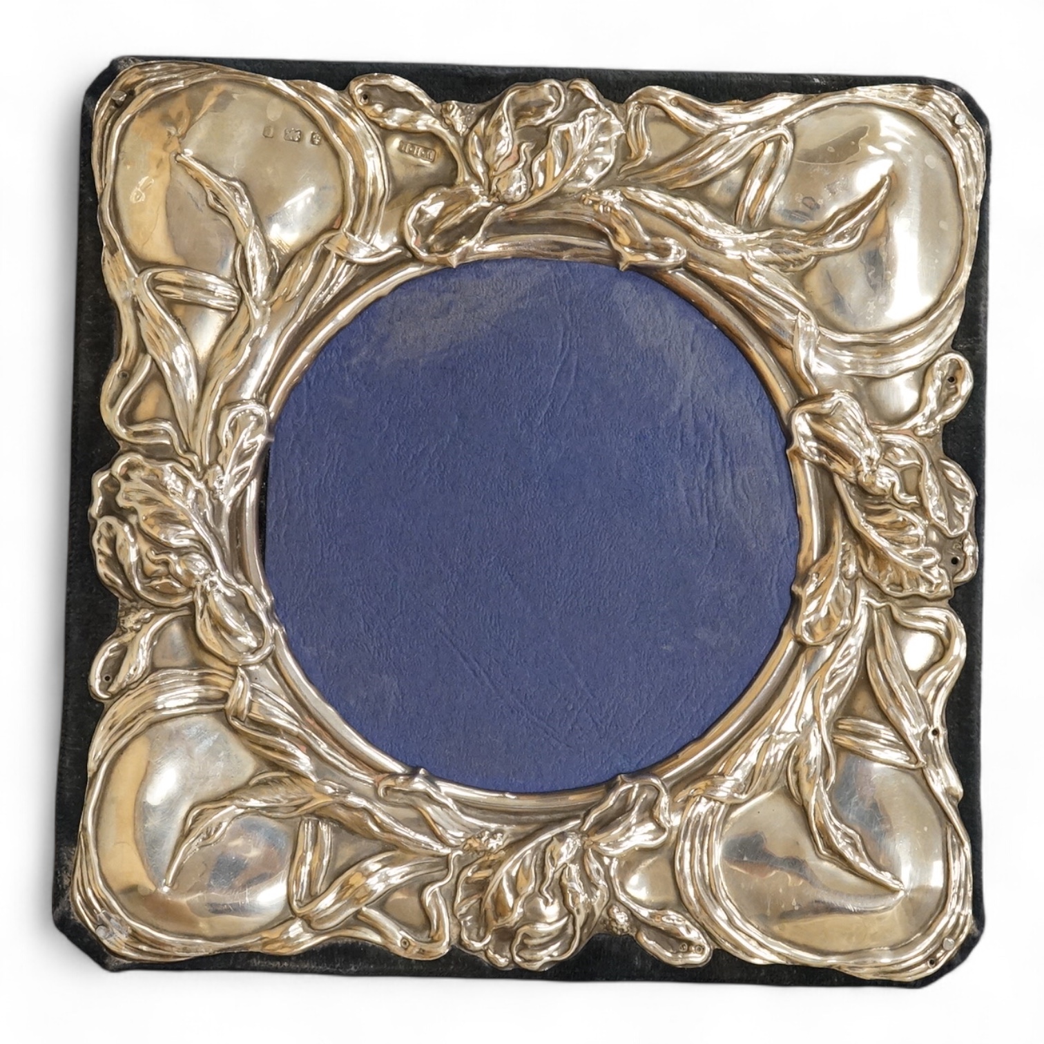 An Edwardian Art Nouveau silver mounted square photograph frame, by William Hair Haseler, Birmingham, 1904, 16cm by 16cm (later backing).